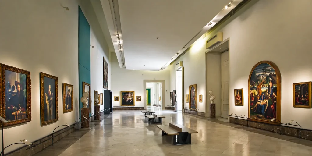 The Farnese Collection gallery inside the Capodimonte Museum in Naples, featuring Renaissance masterpieces without crowds