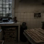 Traditional artisan workshop in Oltrarno Florence with vintage tools, worn wooden worktables, and moody overcast lighting