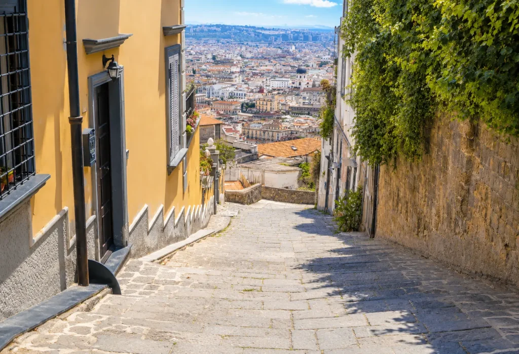 Historic stone steps of Pedamentina a San Martino descending toward Naples city center