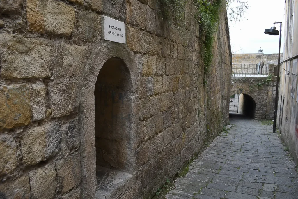 Historic stone passage along Pedamentina a San Martino associated with wartime escape routes in Naples