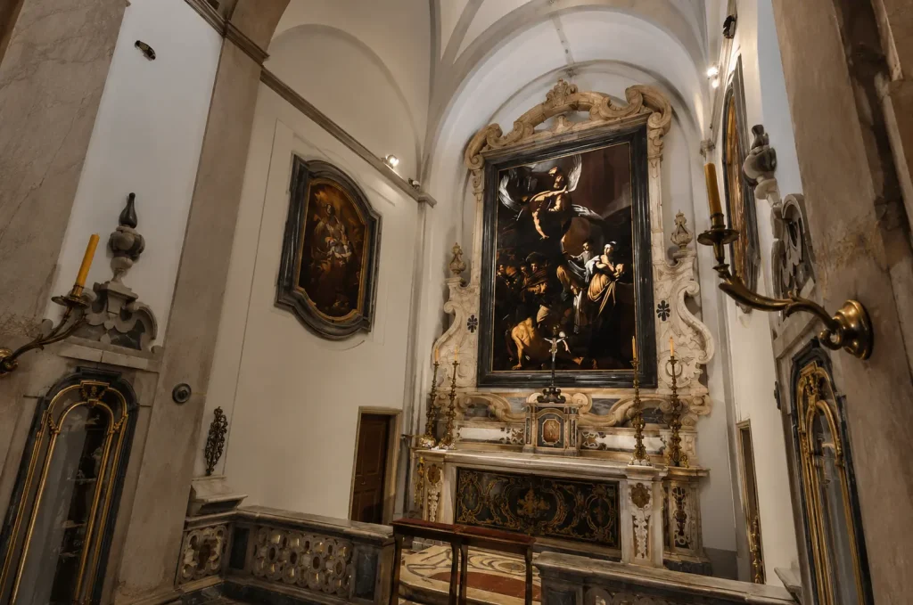 Close-up view of Caravaggio's Seven Works of Mercy inside Pio Monte della Misericordia in Naples