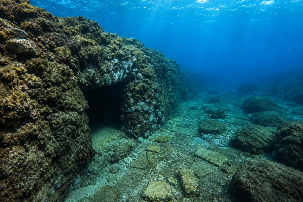 Ancient underwater stone structure and Roman ruins in La Gaiola Underwater Park, Naples, Italy