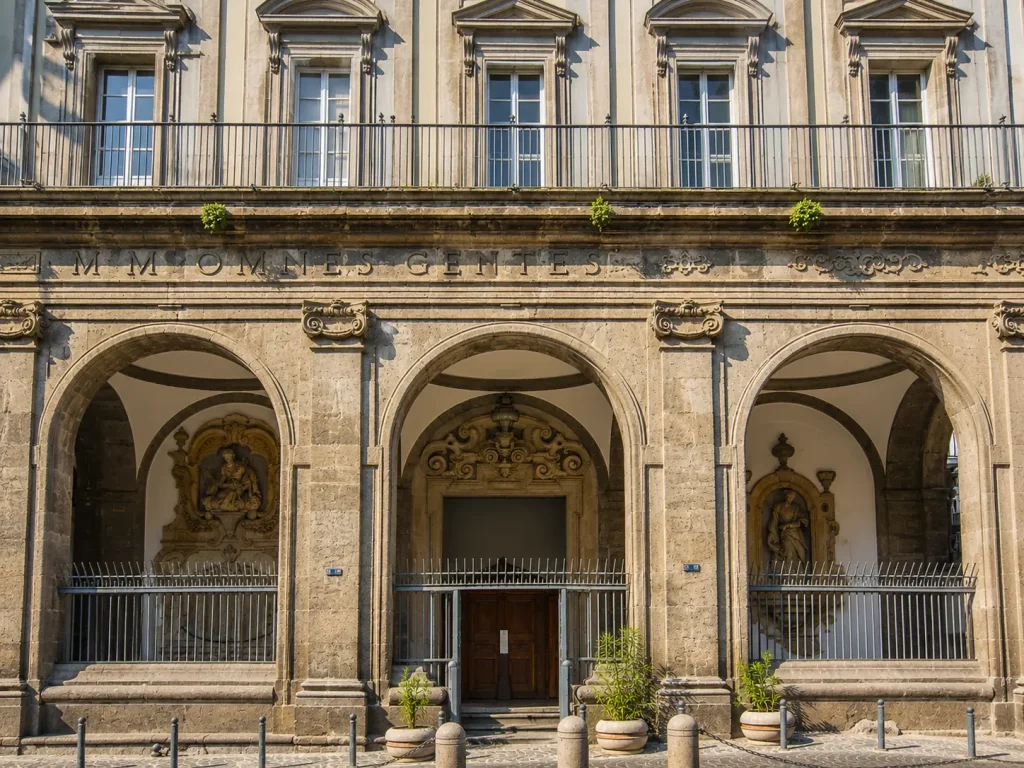 Facade of Pio Monte della Misericordia in Naples historic center on Via dei Tribunali, Italy